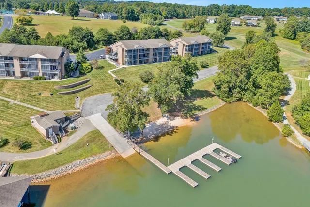 an aerial view of residential house with outdoor space and lake view