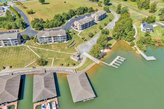 an aerial view of a house with a swimming pool