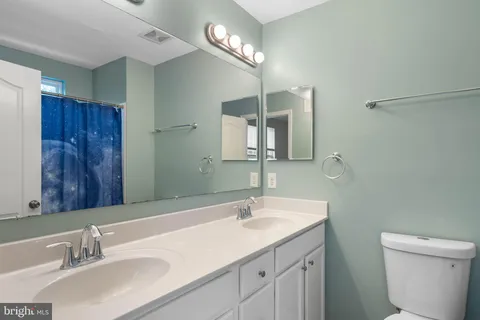 a bathroom with a toilet and a sink