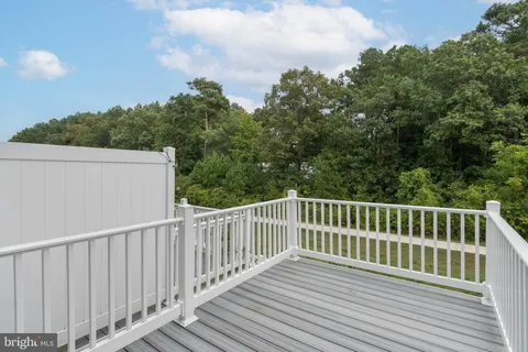 a front view of a residential apartment building with a yard