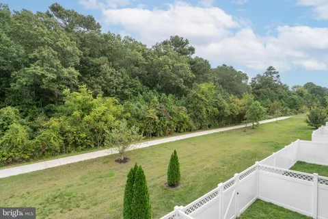 a view of living room with furniture and rug