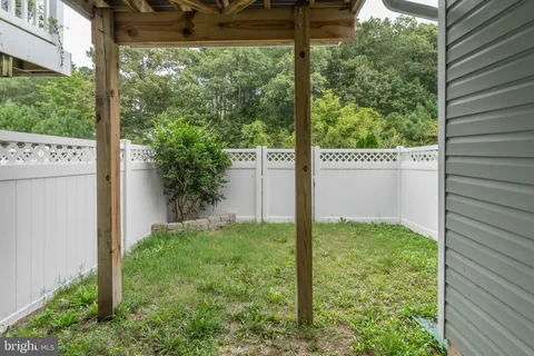a aerial view of a residential apartment building with a yard