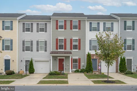 a view of a large building with a yard