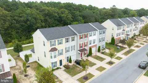 a balcony with table and chairs
