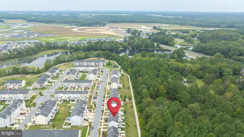 a living room with furniture fireplace and wooden floor