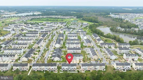 an aerial view of a house with a swimming pool yard and outdoor seating