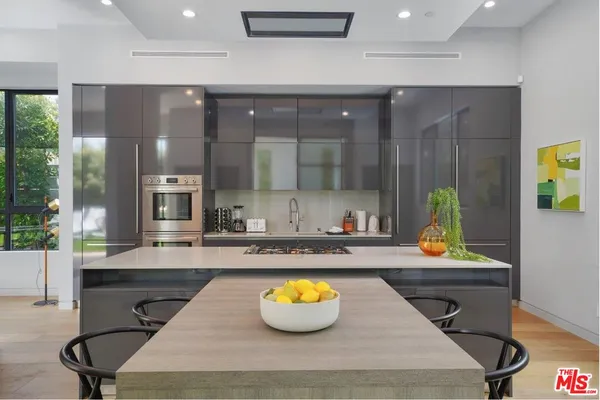 a kitchen with a sink cabinets and window