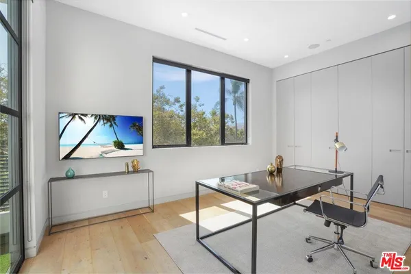 a workspace with furniture and a window