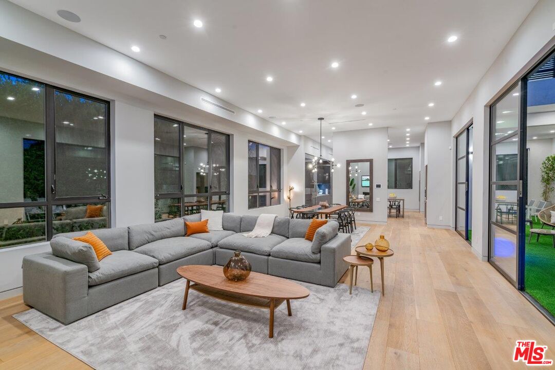 346 North Kings Road Los Angeles, CA 90048 - Photo 3 of 33 a living room with furniture and a large window
