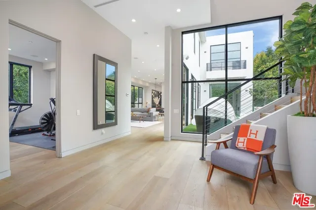 a reading room with furniture and a window