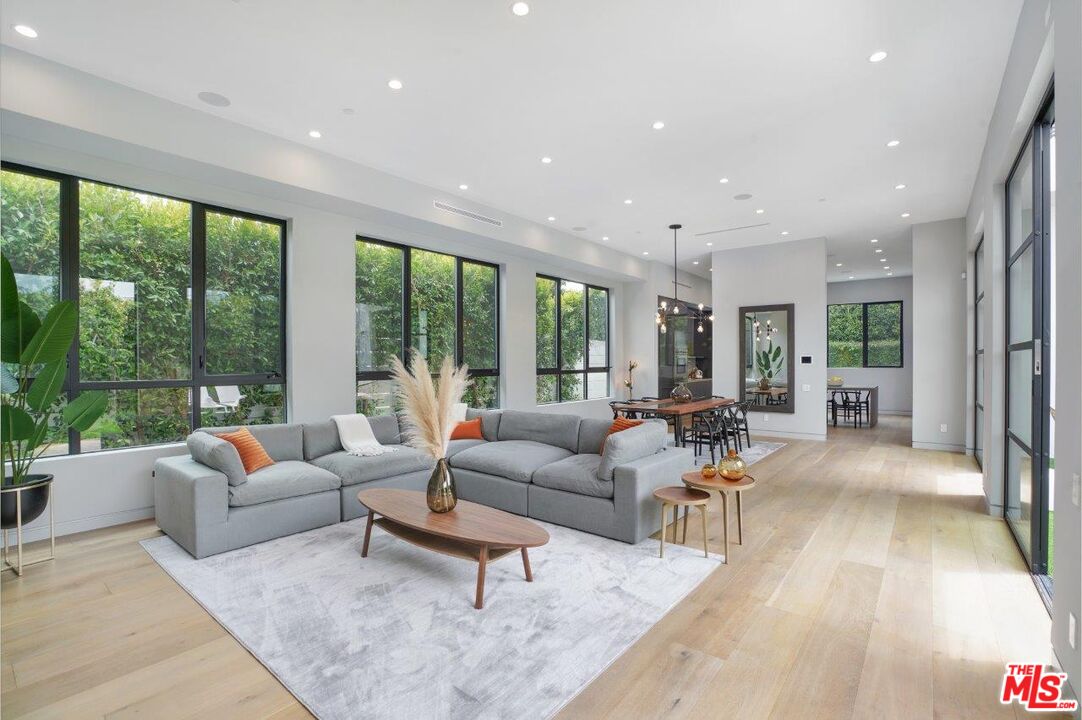 346 North Kings Road Los Angeles, CA 90048 - Photo 8 of 33 a living room with furniture and a large window