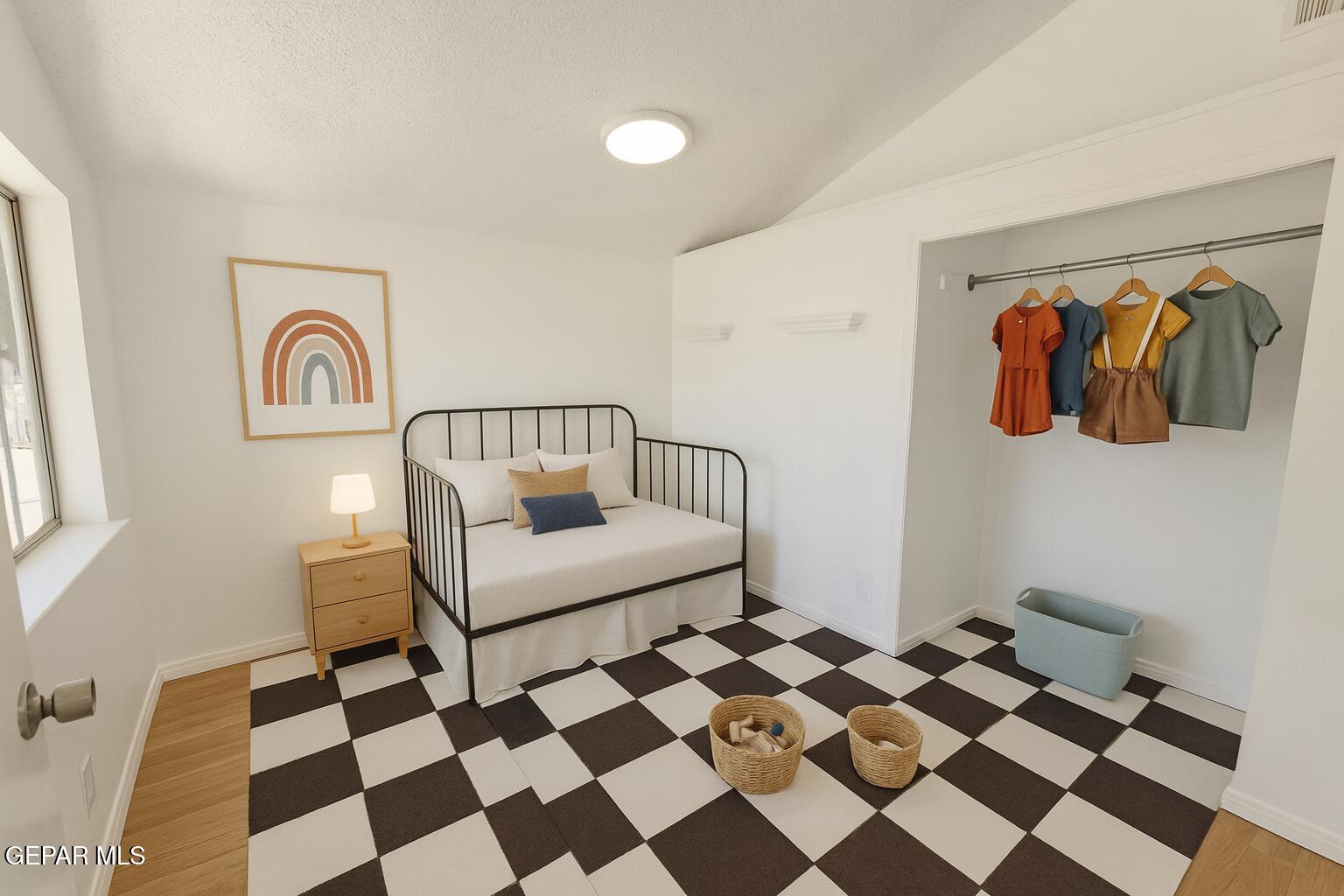 833 Destello Road El Paso, TX 79907 - Photo 13 of 55 a bedroom with a black and white checkered floor