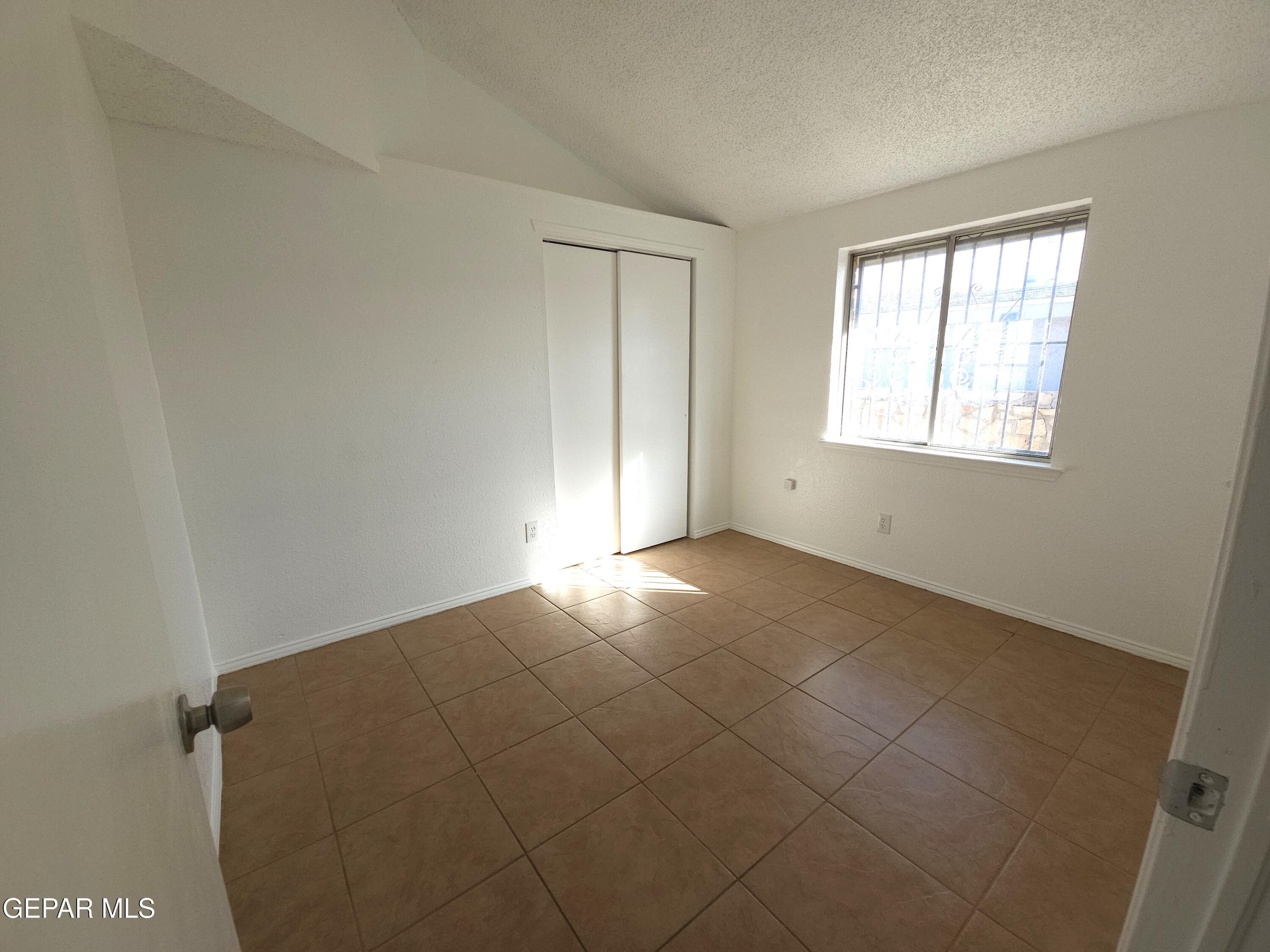 833 Destello Road El Paso, TX 79907 - Photo 20 of 55 an empty room with a window