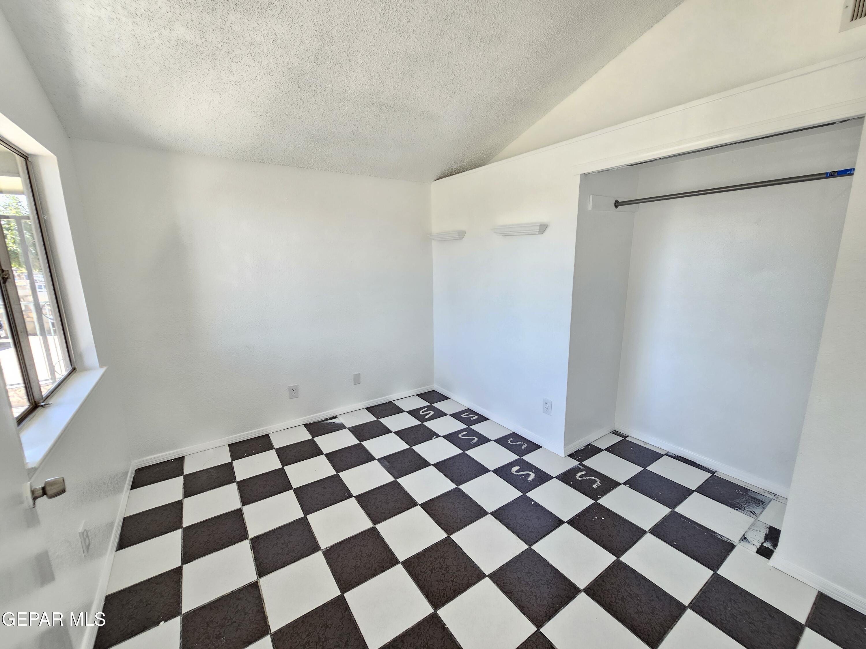833 Destello Road El Paso, TX 79907 - Photo 21 of 55 a black and white checkered floor