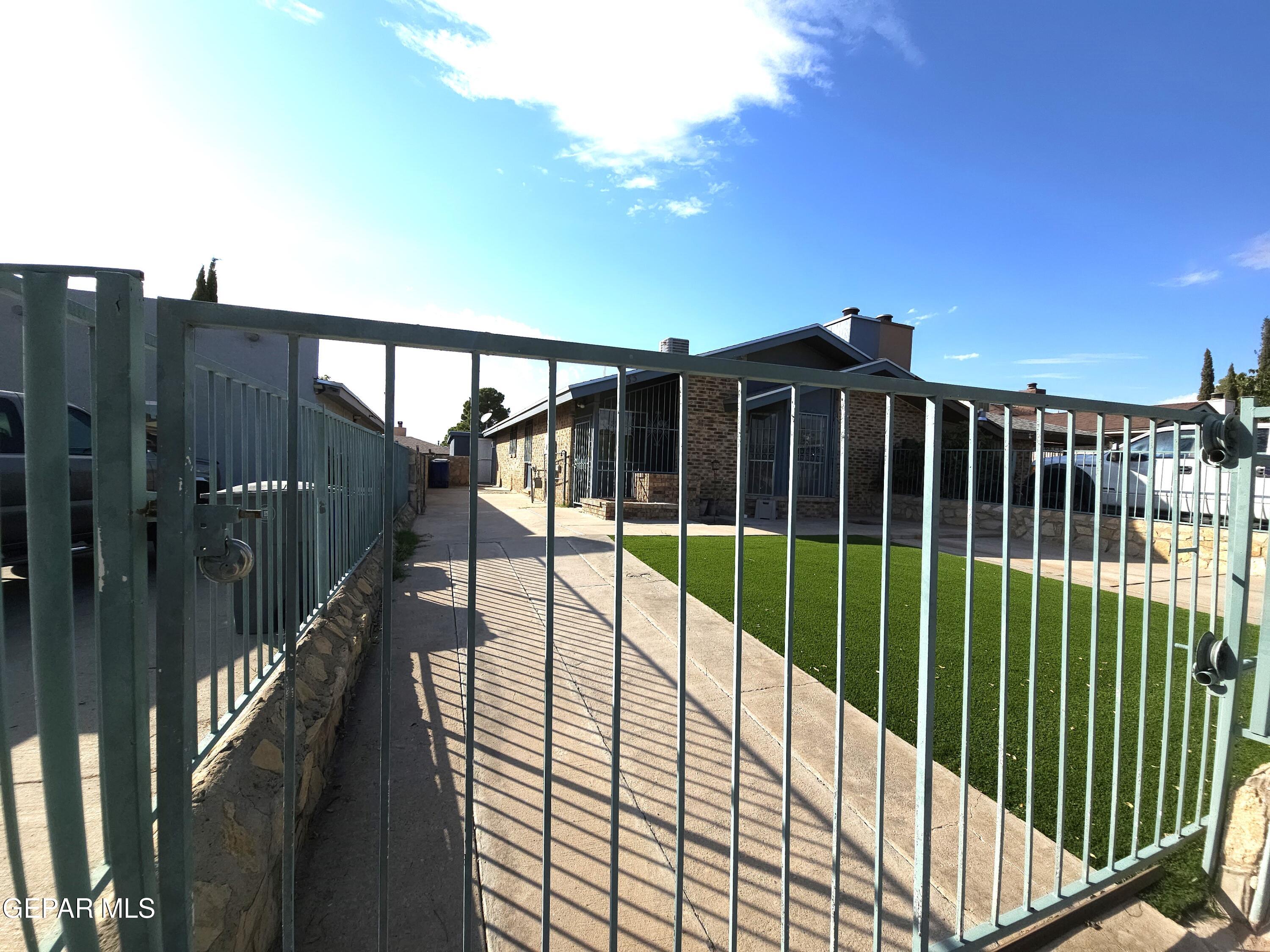 833 Destello Road El Paso, TX 79907 - Photo 5 of 55 a view of houses with a swimming pool