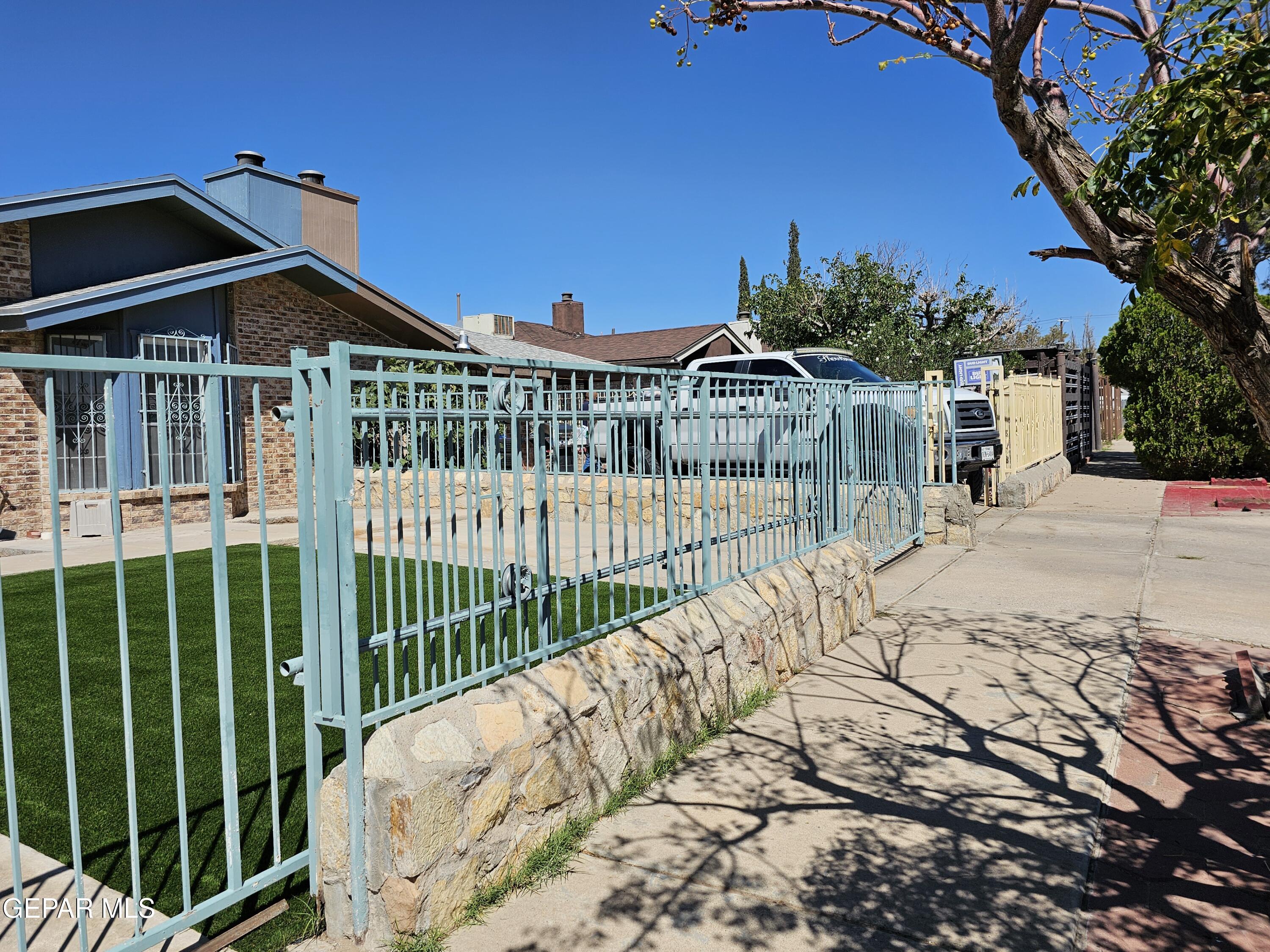 833 Destello Road El Paso, TX 79907 - Photo 7 of 55 a view of a house with a small yard and plants