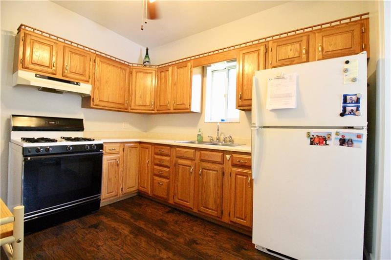 1308 Powers Run Road Pittsburgh, PA 15238 - Photo 7 of 25 Kitchen View With Hardwood Cabinets & New Wood Style Laminate Flooring