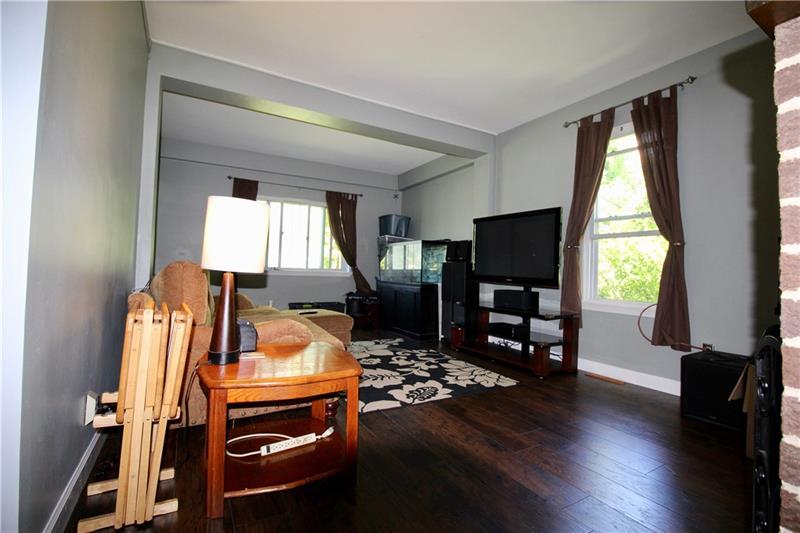 1308 Powers Run Road Pittsburgh, PA 15238 - Photo 9 of 25 Living Room With New Wood Style Laminate Floors