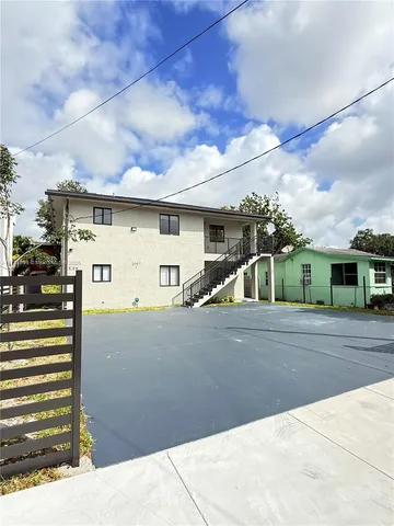 a view of a house with a street