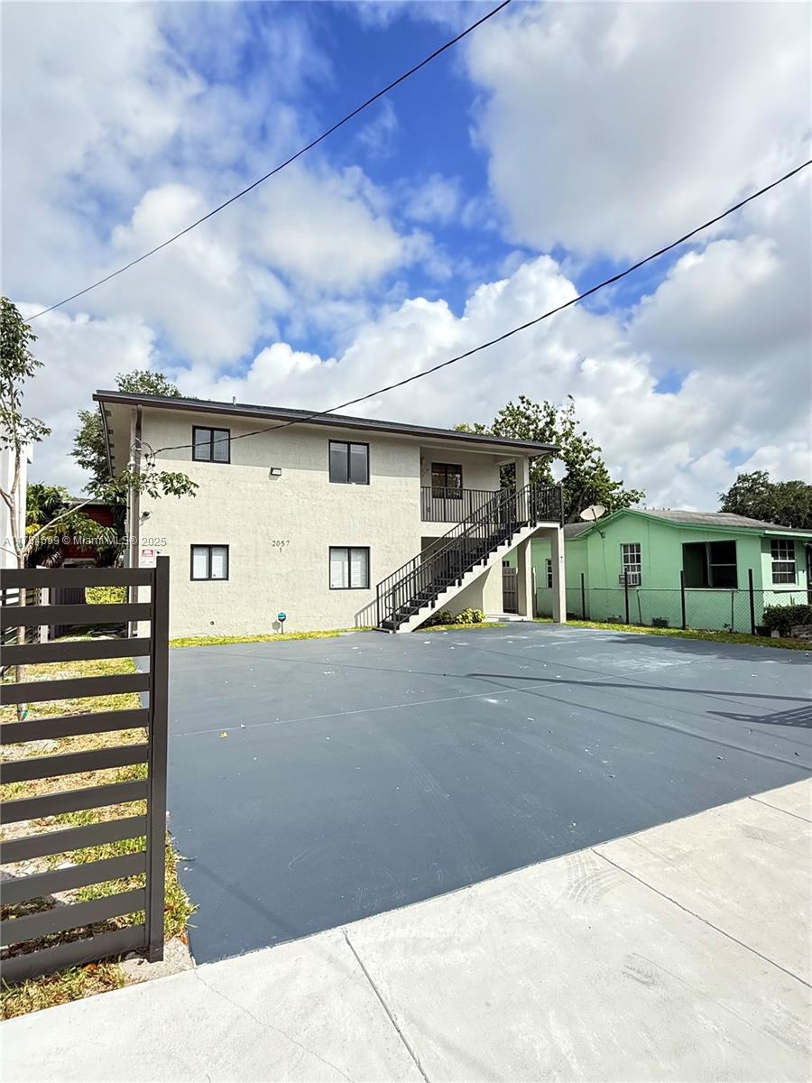 a view of a house with a street