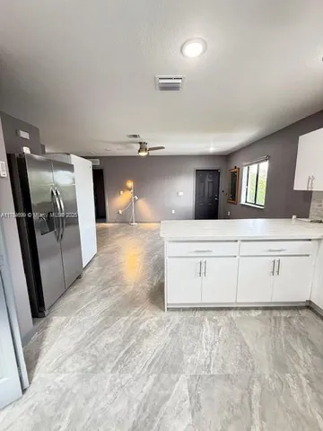 a bathroom with a double vanity sink and mirror
