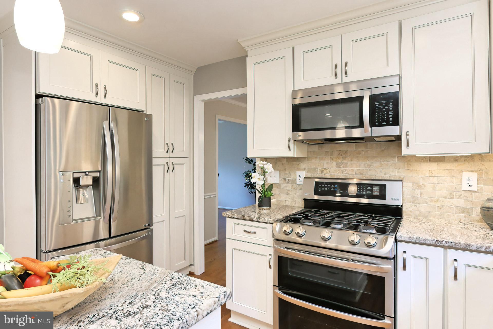 7004 Maple Tree Lane Springfield, VA 22152 - Photo 12 of 58 Gas range with double oven and built-in microwave