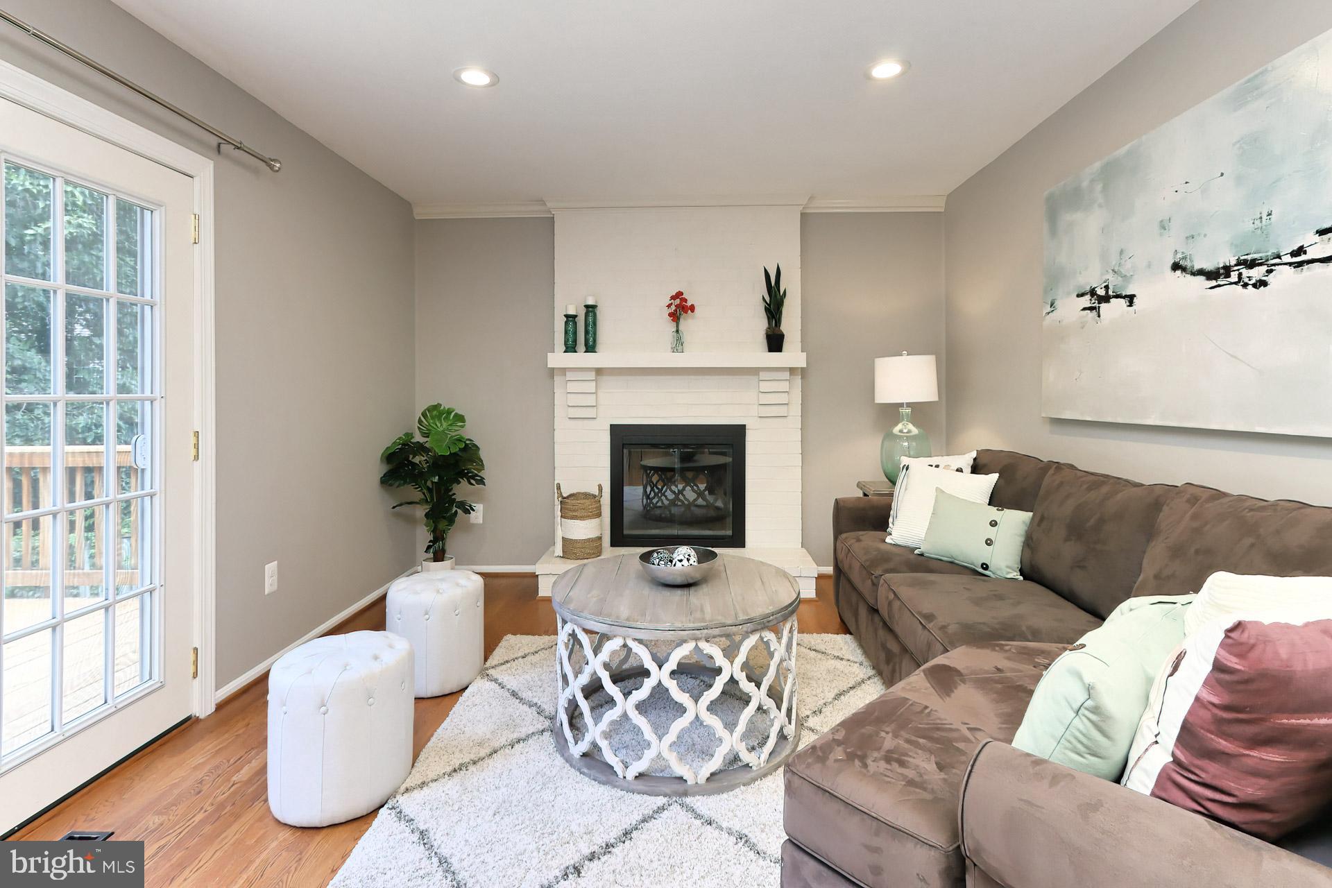 7004 Maple Tree Lane Springfield, VA 22152 - Photo 23 of 58 Brick, wood-burning fireplace with mantel