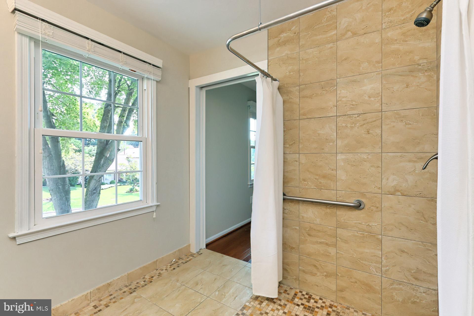 7004 Maple Tree Lane Springfield, VA 22152 - Photo 30 of 58 Huge primary bathroom with step/roll-in shower