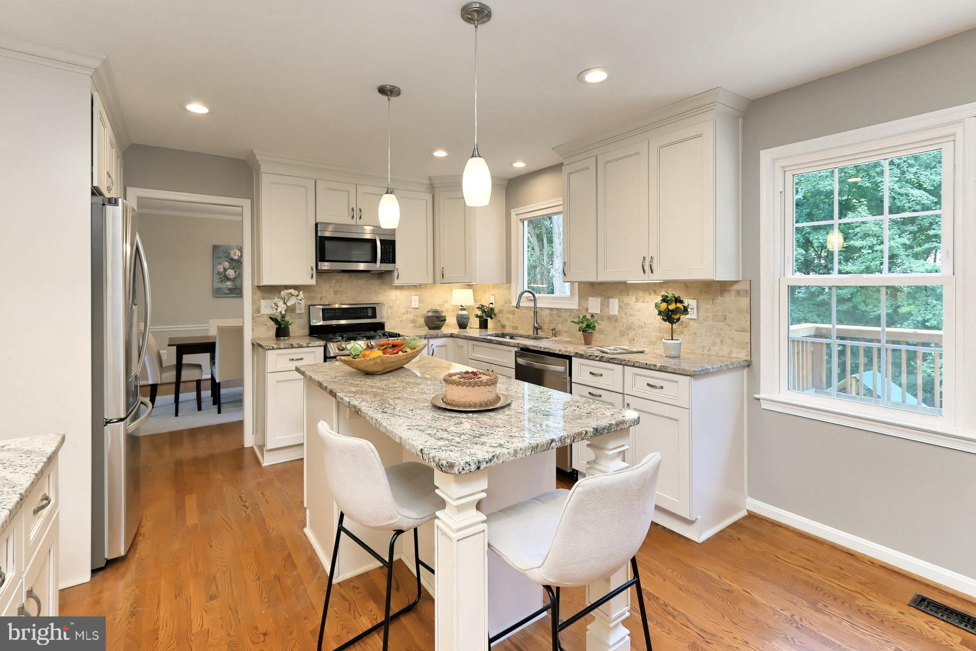 7004 Maple Tree Lane Springfield, VA 22152 - Photo 7 of 58 Large island/breakfast bar with pendant lighting