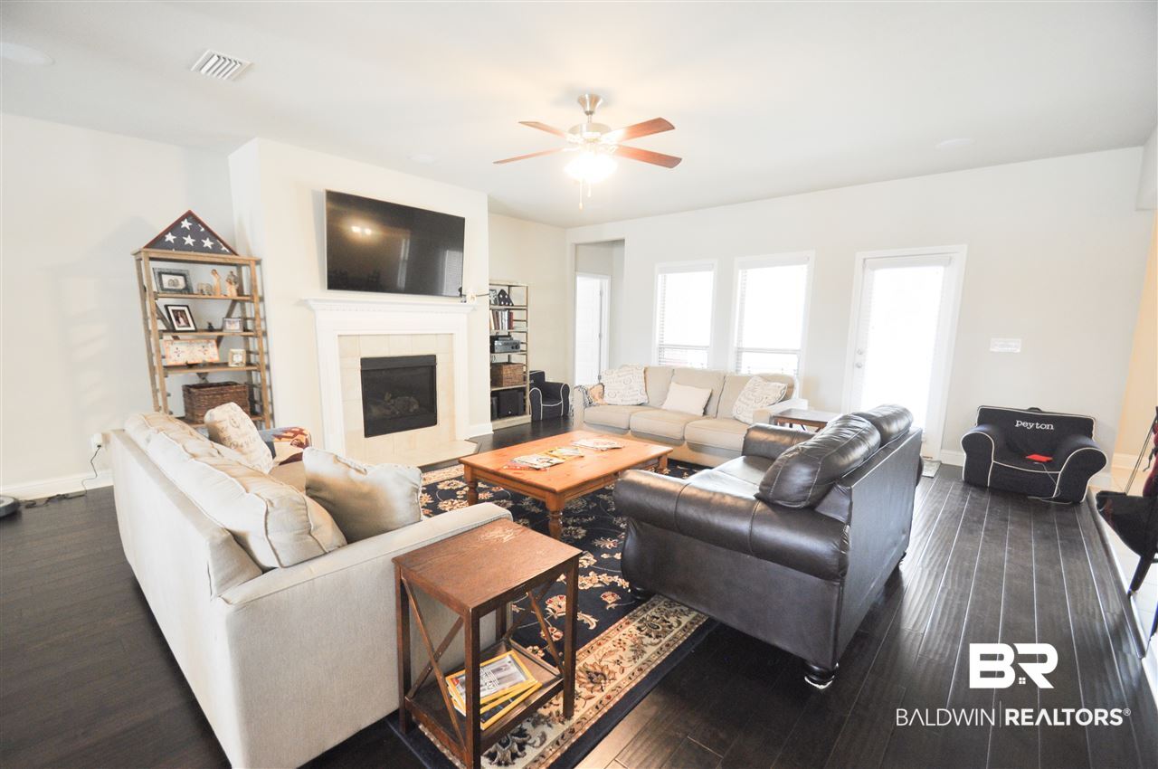 12700 Jenkins Pit Road Daphne, AL 36527 - Photo 3 of 25 Living room with gas fireplace