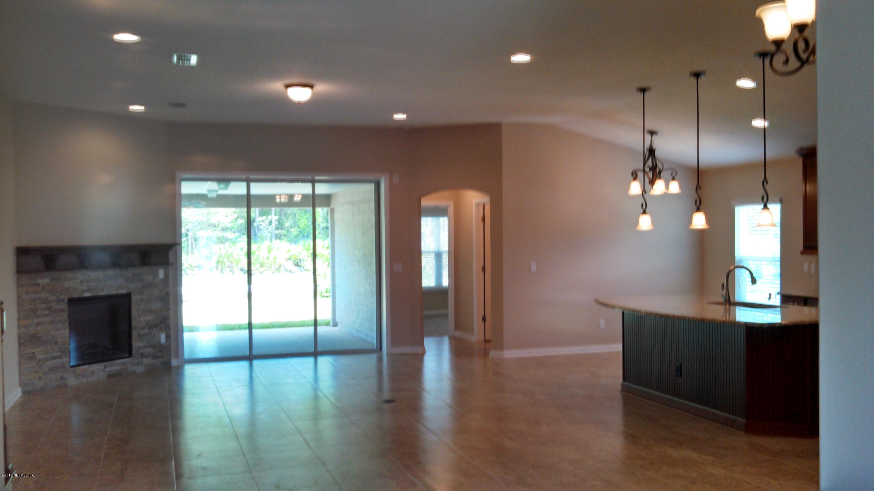 1808 Sugar Maple Road Fleming Island, FL 32003 - Photo 15 of 19 Fleming II family room and kitchen view