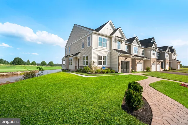 a living room with furniture and a large mirror