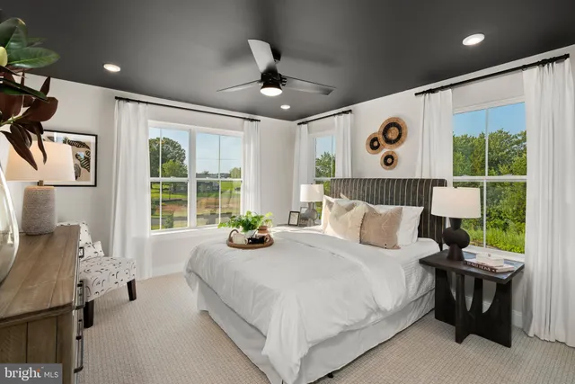 a room with a walk in closet and a mirror