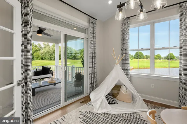 a dining room with furniture and chandelier