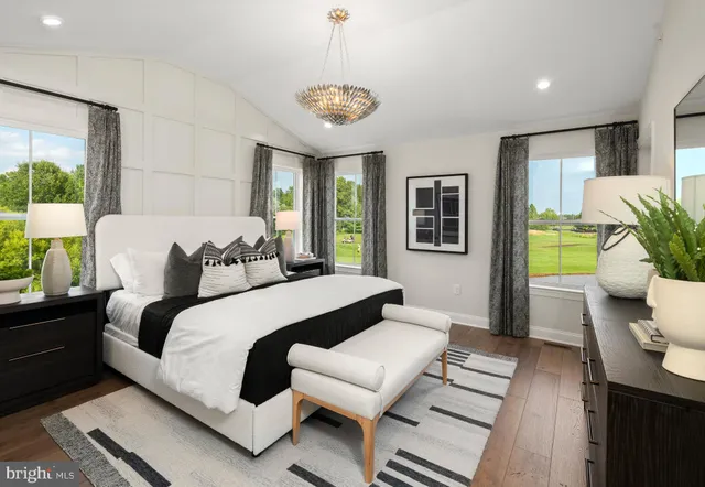 a view of hallway with wooden floor