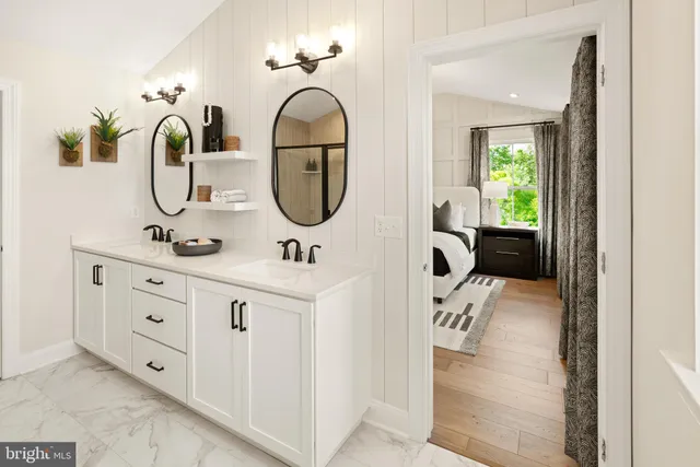 a bedroom with a bed wooden floor and a couch