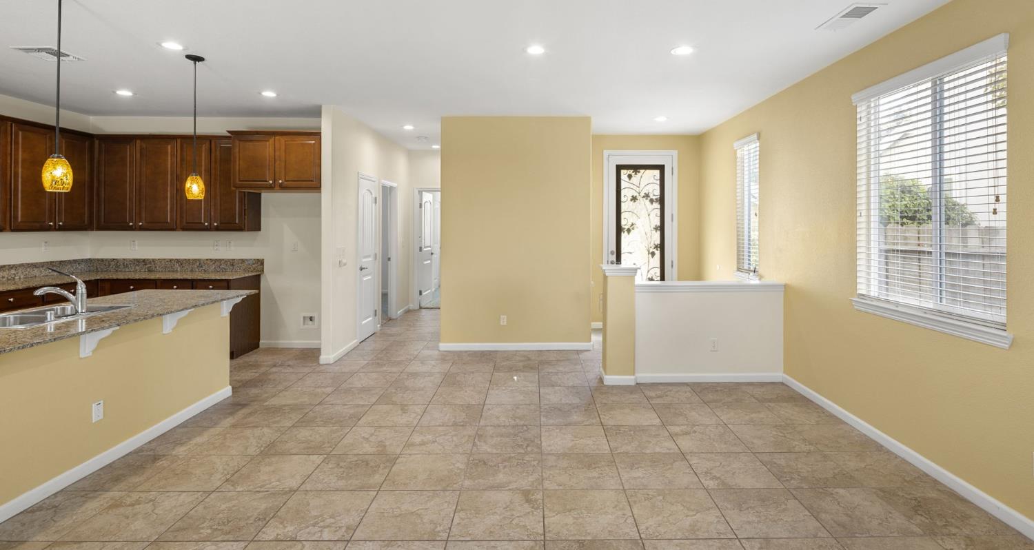 3451 Rainhill Loop Roseville, CA 95747 - Photo 11 of 40 a view of a kitchen with a sink and a window