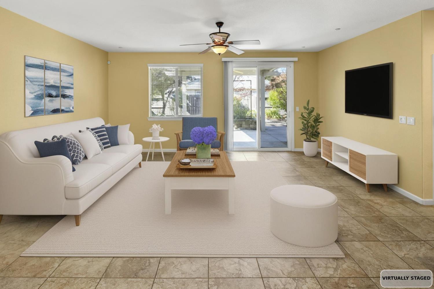 3451 Rainhill Loop Roseville, CA 95747 - Photo 12 of 40 a living room with furniture and a flat screen tv