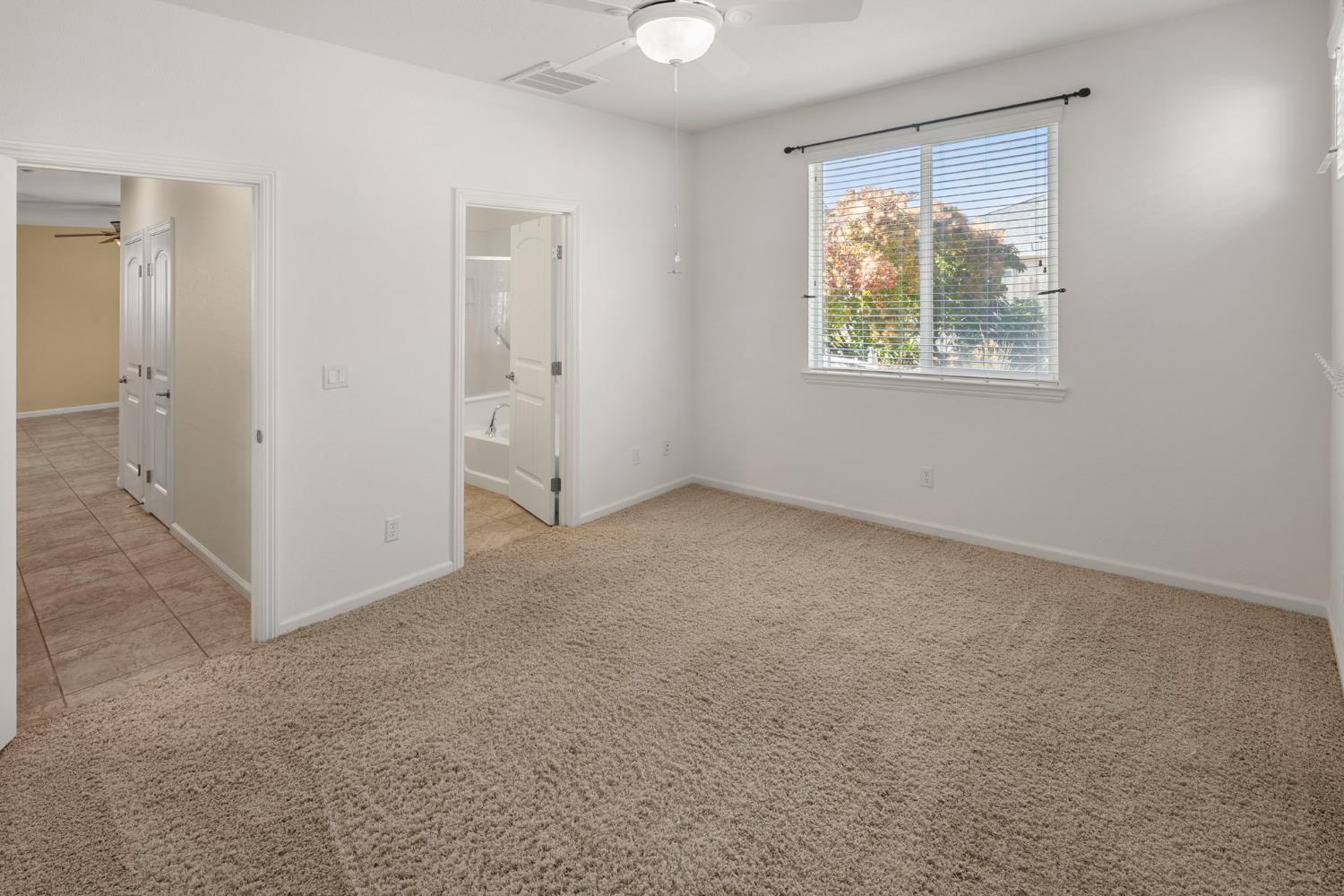3451 Rainhill Loop Roseville, CA 95747 - Photo 16 of 40 an empty room with windows and closet