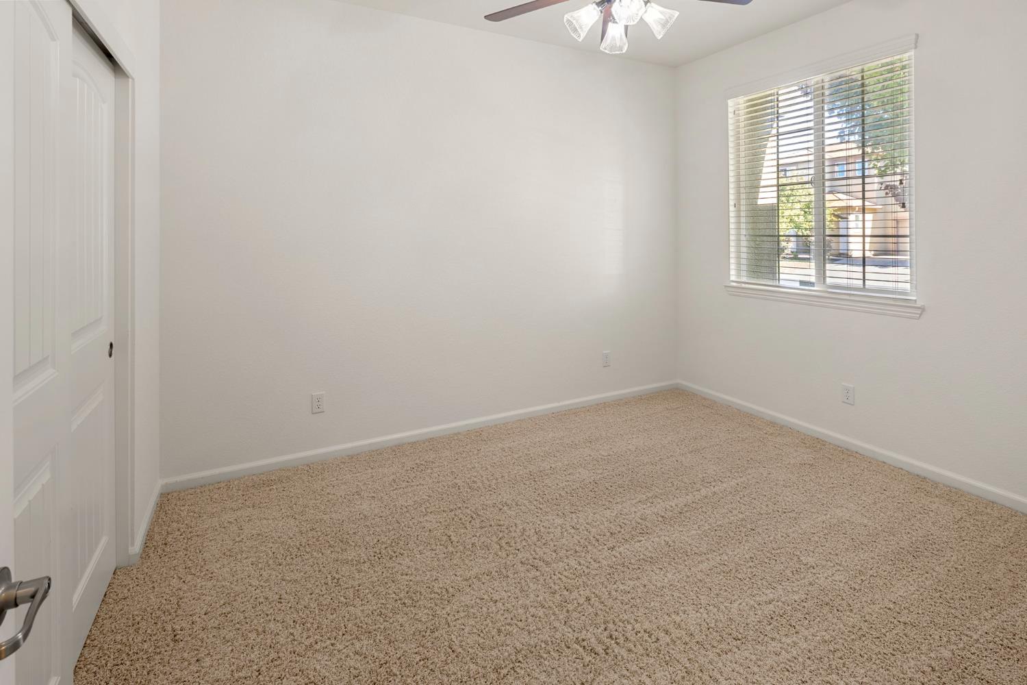 3451 Rainhill Loop Roseville, CA 95747 - Photo 20 of 40 an empty room with a window