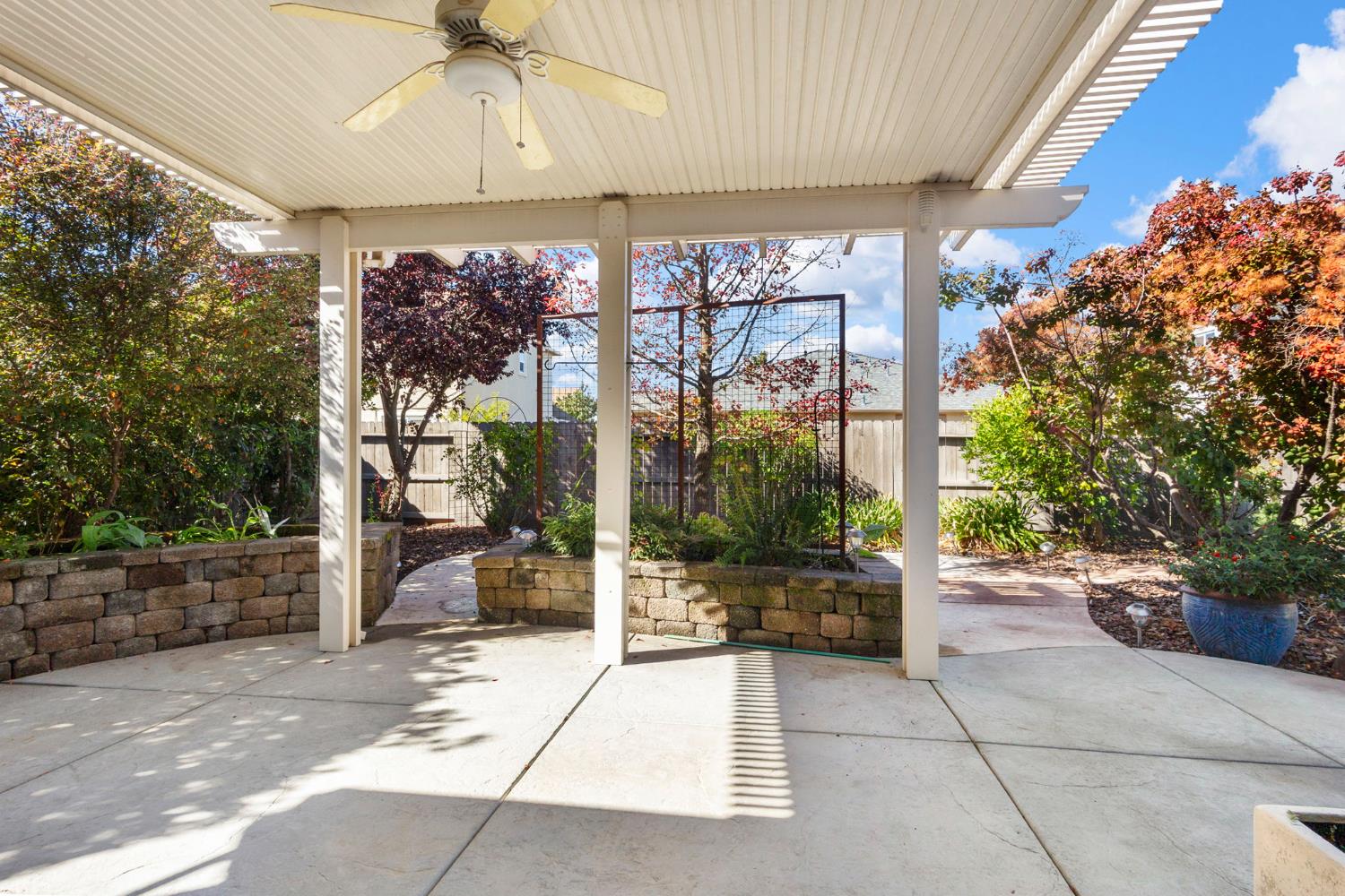 3451 Rainhill Loop Roseville, CA 95747 - Photo 24 of 40 a building outdoor space with glass windows and couches