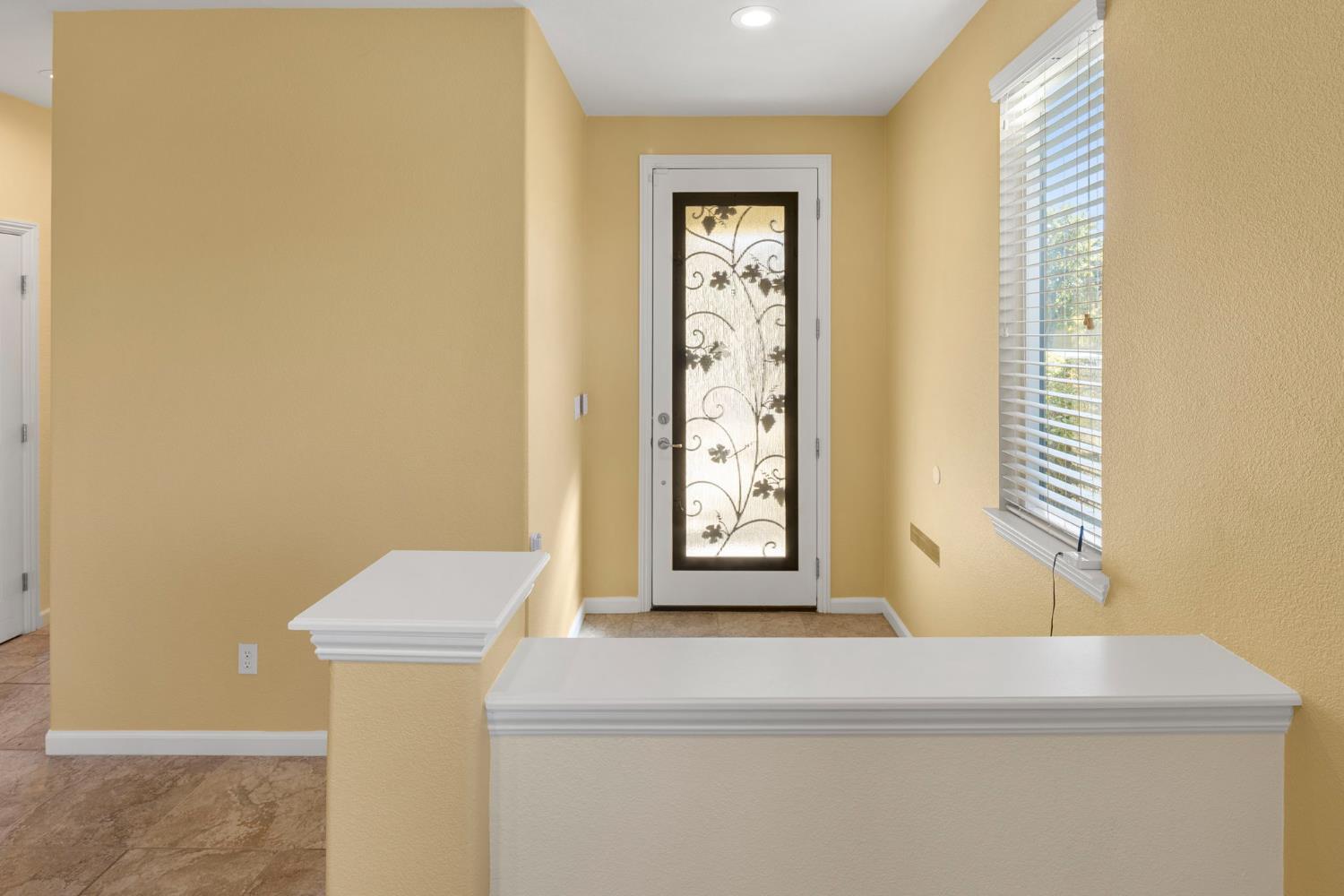 3451 Rainhill Loop Roseville, CA 95747 - Photo 6 of 40 a bathroom with a bathtub and window