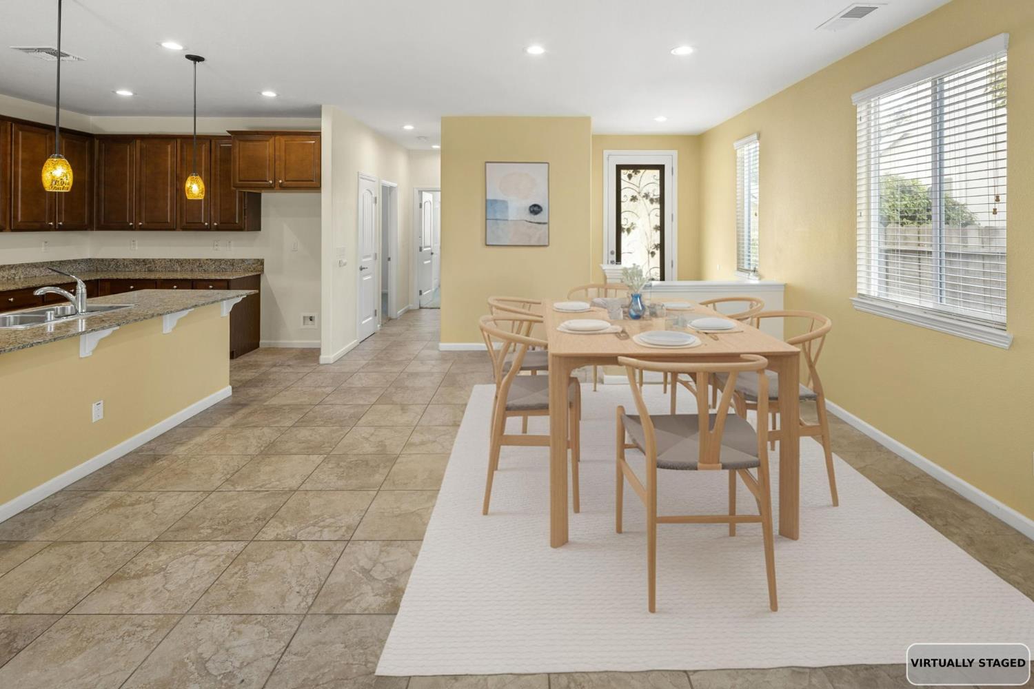 3451 Rainhill Loop Roseville, CA 95747 - Photo 10 of 40 a view of a dining room with furniture and a kitchen