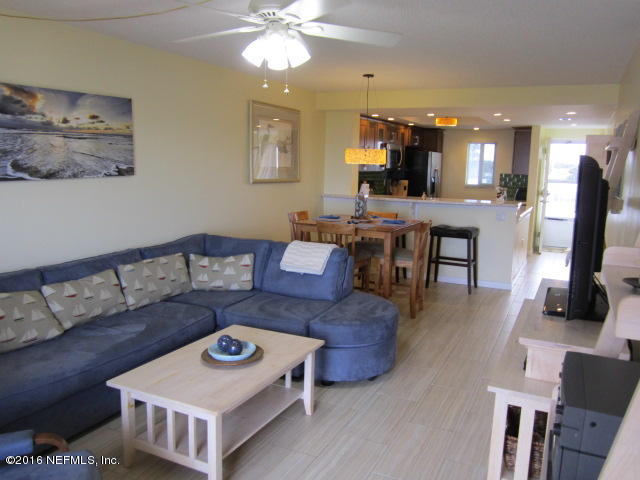 4 Ocean Trace Road, Unit 422 St. Augustine, FL 32080 - Photo 11 of 33 a living room with furniture and a flat screen tv