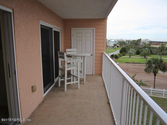 4 Ocean Trace Road, Unit 422 St. Augustine, FL 32080 - Photo 12 of 33 a view of a balcony with chairs and iron gate