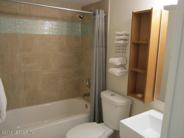 4 Ocean Trace Road, Unit 422 St. Augustine, FL 32080 - Photo 17 of 33 a bathroom with a shower and a toilet