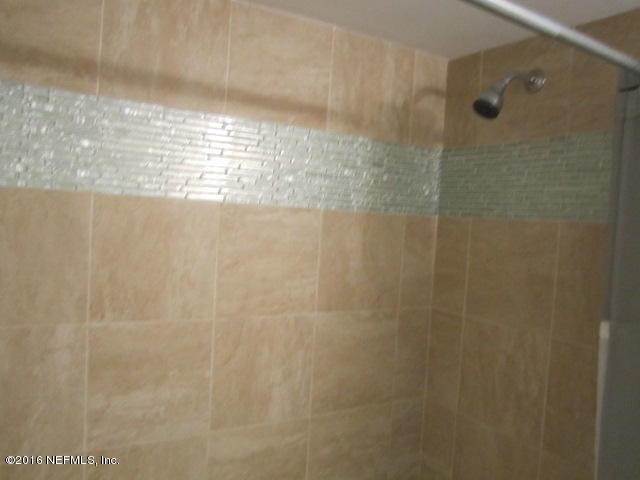 4 Ocean Trace Road, Unit 422 St. Augustine, FL 32080 - Photo 18 of 33 a bathroom with a shower