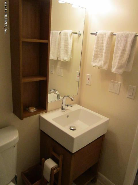 4 Ocean Trace Road, Unit 422 St. Augustine, FL 32080 - Photo 19 of 33 a bathroom with a sink and a toilet