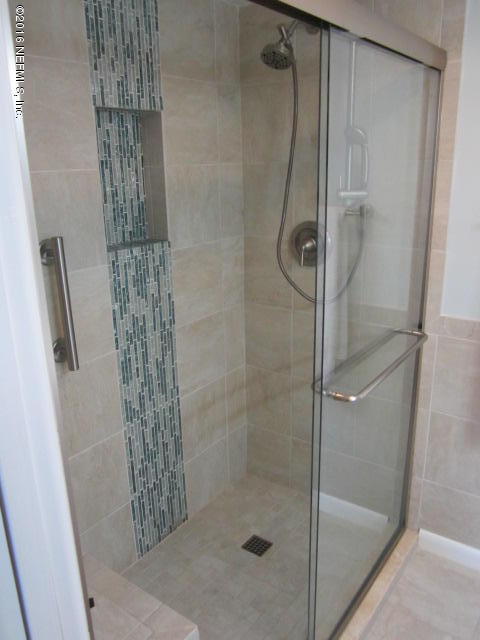 4 Ocean Trace Road, Unit 422 St. Augustine, FL 32080 - Photo 25 of 33 a bathroom with a shower