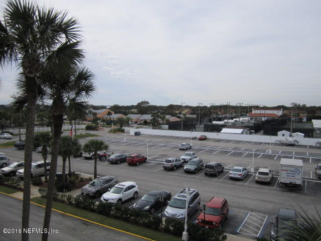 4 Ocean Trace Road, Unit 422 St. Augustine, FL 32080 - Photo 28 of 33 a view of a lake with cars parked